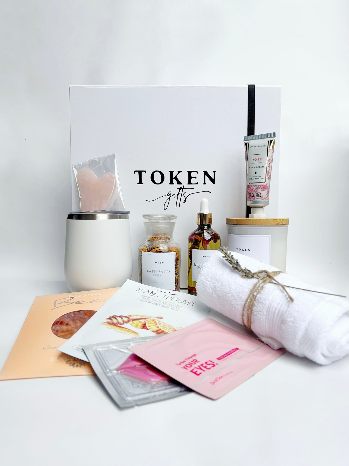 Pamper Her Gift Box. Includes Tumbler, Candle, Body Oil, Bath Salts, Face, Eye and Lip Mask, Hand Cream and Rose Gummies. 